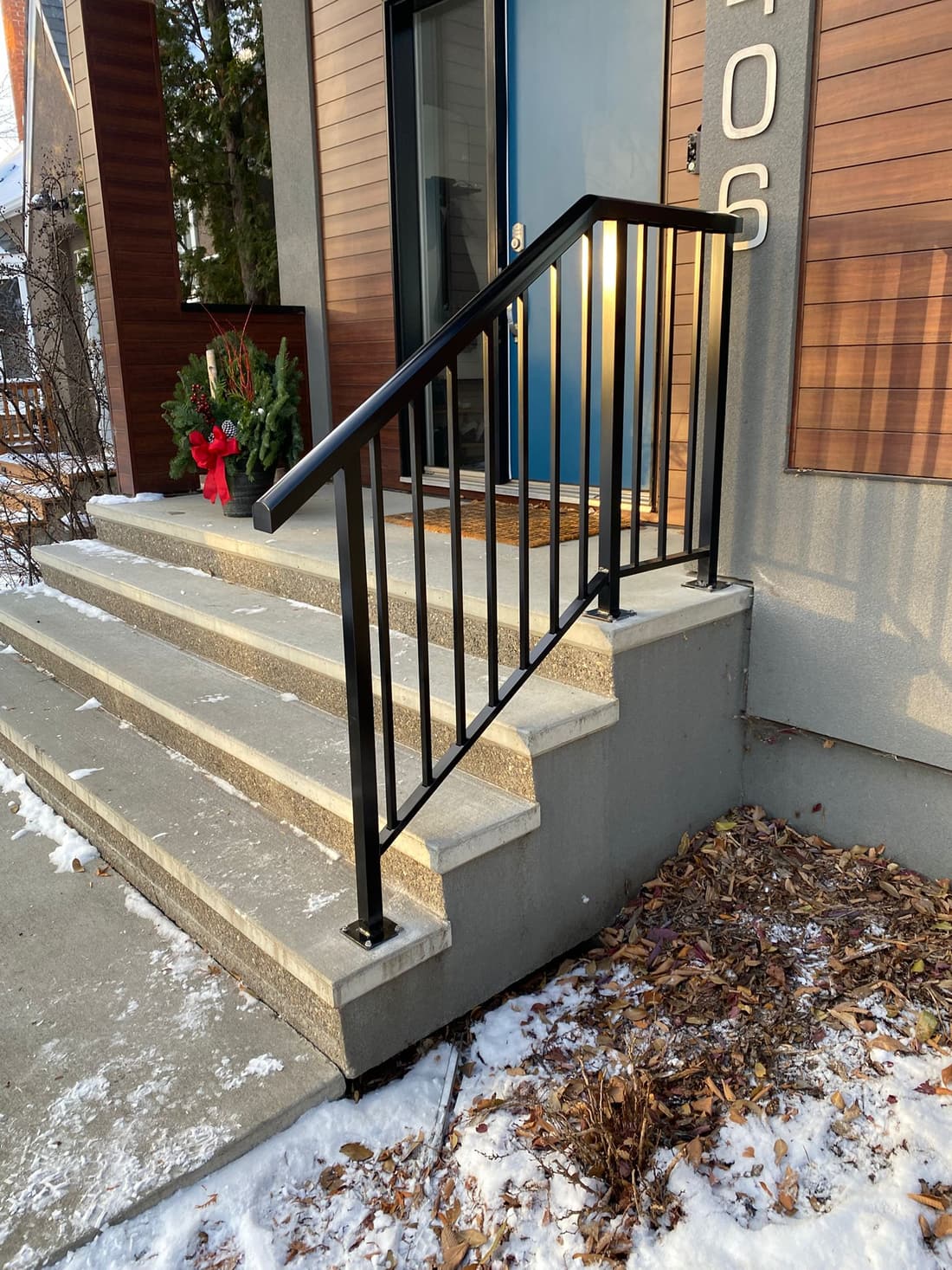 Black aluminum railing on residential steps in Edmonton
